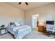 Comfortable bedroom with a ceiling fan, and a door, creating a relaxing retreat at 555 Gallegos Cir, Erie, CO 80516