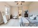 Bright bedroom featuring a ceiling fan, a mirror, and an open closet at 555 Gallegos Cir, Erie, CO 80516