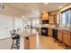 Bright eat-in kitchen with stainless steel appliances, a center island with seating and a dedicated dining area at 555 Gallegos Cir, Erie, CO 80516