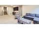 Cozy living area featuring a wet bar, stairs to the upper level, and comfortable seating at 555 Gallegos Cir, Erie, CO 80516