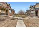 A neighborhood view showcasing well-maintained landscaping at 555 Gallegos Cir, Erie, CO 80516