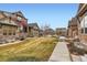 Charming neighborhood view showcasing well-maintained lawns and inviting curb appeal at 555 Gallegos Cir, Erie, CO 80516