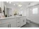 Bathroom with double vanity, granite countertop, and glass shower at 1335 N Alton St, Aurora, CO 80010