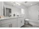 Bathroom with double vanity, granite countertop, tub and shower at 1335 N Alton St, Aurora, CO 80010