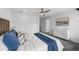 Bright bedroom featuring a ceiling fan, dresser and neutral color scheme at 1335 N Alton St, Aurora, CO 80010