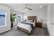 Bedroom with windows and natural light, a ceiling fan and gray carpet at 1335 N Alton St, Aurora, CO 80010