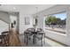 Charming dining area with a round table set for four, next to large windows at 1335 N Alton St, Aurora, CO 80010