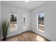 Sunlit entryway with wood flooring and large windows, offering a welcoming feel at 1335 N Alton St, Aurora, CO 80010