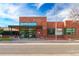 Brick building with modern entrance and awning, featuring ample windows and clear signage at 1335 N Alton St, Aurora, CO 80010