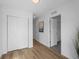 Bright hallway with wood floors, closet, and access to multiple rooms at 1335 N Alton St, Aurora, CO 80010
