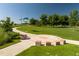 Scenic park with a winding path, decorative art installations, and lush green lawns perfect for recreation at 1335 N Alton St, Aurora, CO 80010