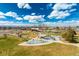 Scenic park view featuring playground equipment, lush greenery, and blue skies at 1335 N Alton St, Aurora, CO 80010