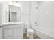 Bright white bathroom with tile shower and modern vanity at 2887 E 103Rd Dr, Thornton, CO 80229