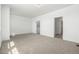 Large, carpeted bedroom with an ensuite bathroom and large walk in closet at 2887 E 103Rd Dr, Thornton, CO 80229