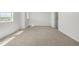 Bright bedroom with neutral carpet, base trim, and natural light from the windows at 2887 E 103Rd Dr, Thornton, CO 80229