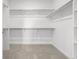 Walk-in closet with built in shelving and neutral colored carpet at 2887 E 103Rd Dr, Thornton, CO 80229