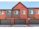 Beautiful townhouse exterior with a gray garage door at 2887 E 103Rd Dr, Thornton, CO 80229
