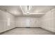 Spacious unfinished garage with concrete flooring and drywall at 2887 E 103Rd Dr, Thornton, CO 80229