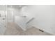 Bright hallway with neutral carpet and white trim, leading to other rooms at 2887 E 103Rd Dr, Thornton, CO 80229