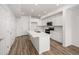 Modern kitchen featuring a central island, sleek countertops, and ample storage at 2887 E 103Rd Dr, Thornton, CO 80229