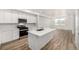 Modern kitchen with stainless steel appliances and island at 2887 E 103Rd Dr, Thornton, CO 80229