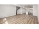 Bright, open-concept living room with modern wood floors and ample space at 2887 E 103Rd Dr, Thornton, CO 80229