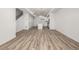 Open-concept living space with sleek wood flooring, perfect for entertaining at 2887 E 103Rd Dr, Thornton, CO 80229