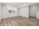 Bright, airy room with large windows, recessed lighting, and beautiful light wood-look flooring at 2887 E 103Rd Dr, Thornton, CO 80229