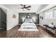 Cozy bedroom with wood floors, decorative wall art and ceiling fan at 550 S Xenon Ct, Lakewood, CO 80228