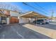 Exterior view showing carport parking area and unit, with a covered parking space at 550 S Xenon Ct, Lakewood, CO 80228