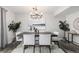 Dining room features a chandelier and neutral colors; an ideal spot for entertaining at 550 S Xenon Ct, Lakewood, CO 80228