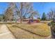 Community playground featuring swings, slides, and climbing structures for children to enjoy in a park setting at 550 S Xenon Ct, Lakewood, CO 80228