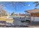 Community pool that is fenced in with an outdoor seating area for residents to gather around at 550 S Xenon Ct, Lakewood, CO 80228