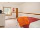Well-lit bedroom showcasing a cozy carpet, a modern dresser, and a side table at 11163 Conifer Mountain Rd, Conifer, CO 80433