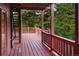 Spacious wood deck overlooking the wooded property at 11163 Conifer Mountain Rd, Conifer, CO 80433