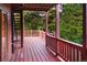 Spacious outdoor deck with forest views, offering an open-air experience at 11163 Conifer Mountain Rd, Conifer, CO 80433