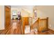Warm and inviting entryway with hardwood floors, wooden accents, and an abundance of natural light at 11163 Conifer Mountain Rd, Conifer, CO 80433