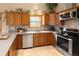 Well-equipped kitchen with stainless steel appliances, ample counter space, and tile backsplash at 11163 Conifer Mountain Rd, Conifer, CO 80433