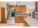 Kitchen with island, stainless appliances and an open layout to the living room with fireplace at 11163 Conifer Mountain Rd, Conifer, CO 80433