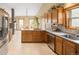 Open kitchen design with island, stainless appliances, and plenty of counter space for cooking at 11163 Conifer Mountain Rd, Conifer, CO 80433