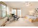 Large and airy primary bedroom features a seating area and calming nature views at 11163 Conifer Mountain Rd, Conifer, CO 80433