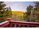 Scenic view of the green hillside from the property's deck at 11163 Conifer Mountain Rd, Conifer, CO 80433