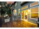 View of the spacious wet back deck of this home at sunset with views into the open interior at 670 Somerset Dr, Golden, CO 80401