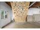 Climbing wall in an unfinished basement illuminated by a window at 670 Somerset Dr, Golden, CO 80401