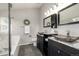 Modern bathroom featuring dual vessel sinks, dark vanities, and updated fixtures at 670 Somerset Dr, Golden, CO 80401