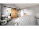 Bedroom with modern barn door leading to an en suite bathroom and walk-in closet at 670 Somerset Dr, Golden, CO 80401