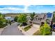 Green house featuring an attached garage and solar panels, nestled in a neighborhood with scenic mountain views at 670 Somerset Dr, Golden, CO 80401