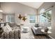 Bright living room with contemporary furniture, vaulted ceiling, and large windows for ample natural light at 670 Somerset Dr, Golden, CO 80401