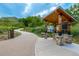 View of a community information kiosk with a walking path and green grass in the background at 670 Somerset Dr, Golden, CO 80401
