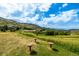 View of park benches with a hill in the background on a sunny day at 670 Somerset Dr, Golden, CO 80401